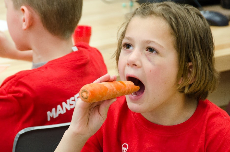 Child eating a carrot