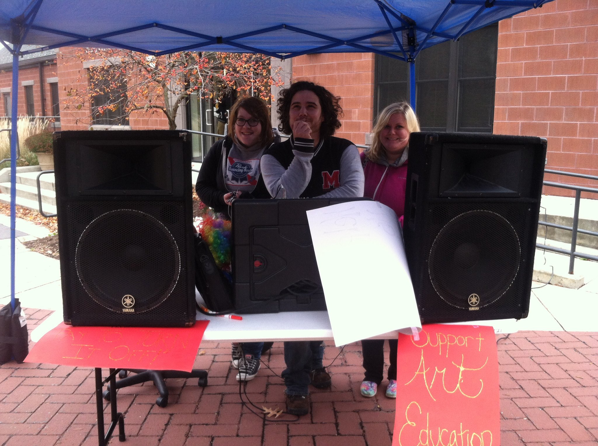 Students staffing a radio station booth on the Mall