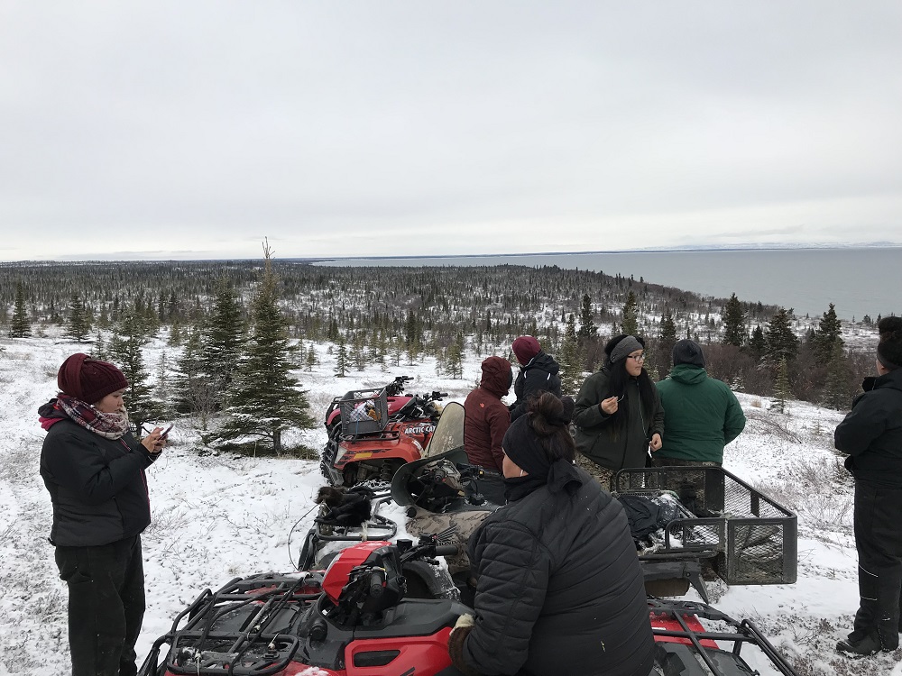 students on snowmobiles