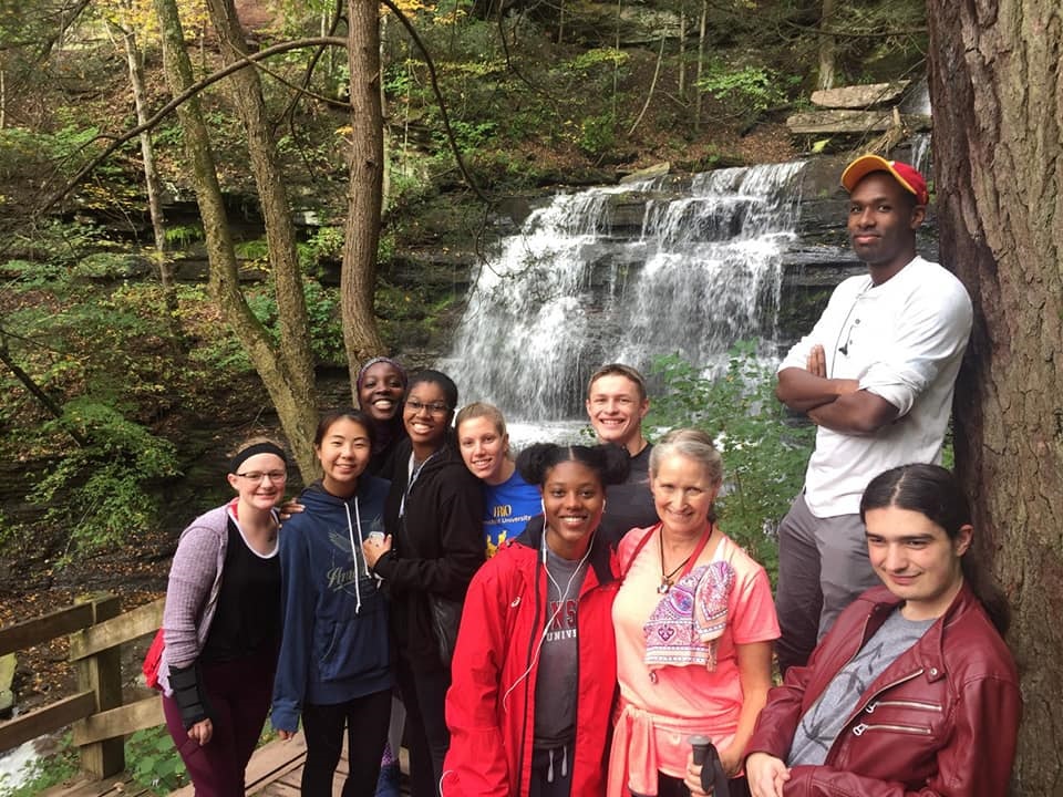Student group in front of waterfall